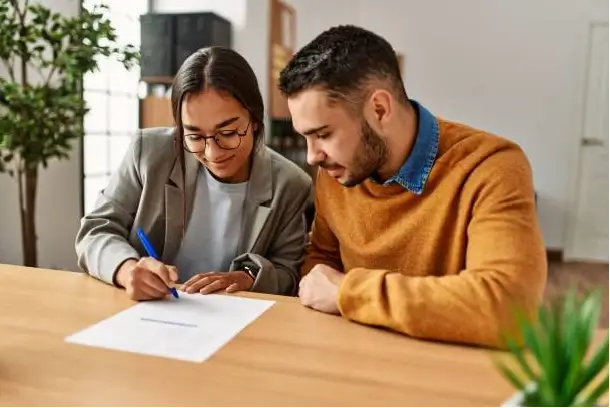 Happy couple cheering their successful new home purchase thanks to Prime Rate Mortgage ™