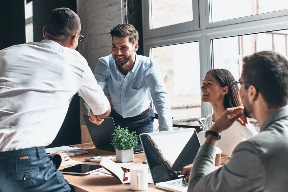 A group of friends together in a business meeting.